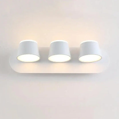 White minimalist wall lamp with three cylindrical lamps featuring decorbites adjustable led for bedroom sconce use