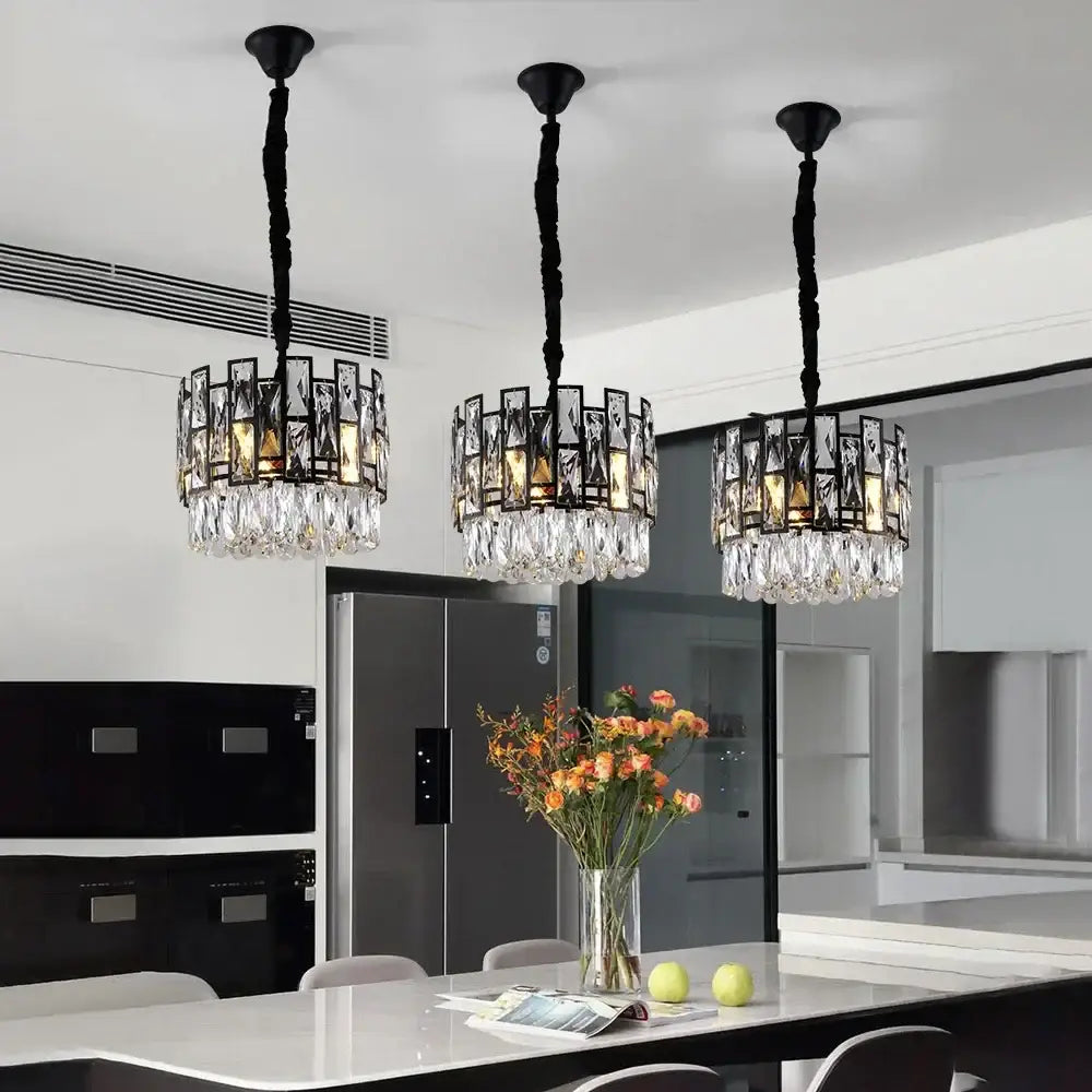Three black-framed decorbites crystal led chandeliers with hanging clear glass crystals for dining room lighting