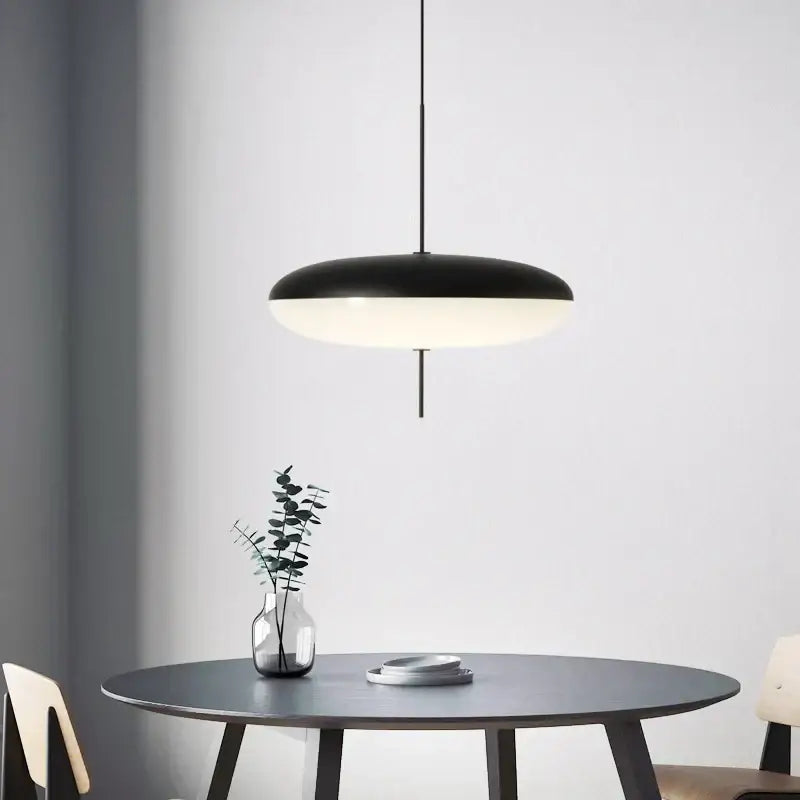 Modern black designer iron pendant light with black and white disc-shaped shade for dining room and bar decorbites designer iron pendant