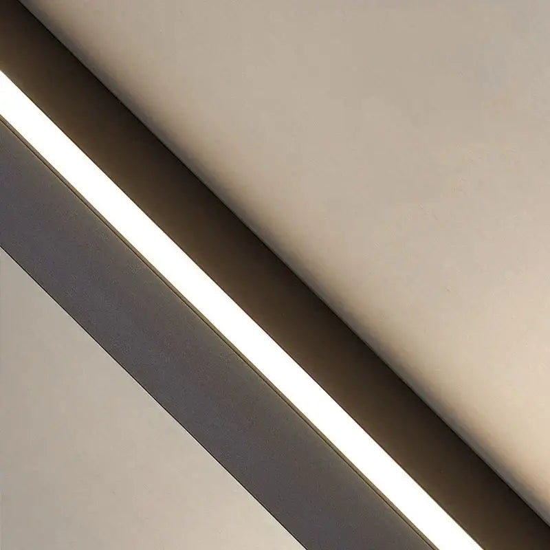A modern black dimmable long wall lamp with a slim led strip light and warm white illumination for bedroom decorbites ambient lighting