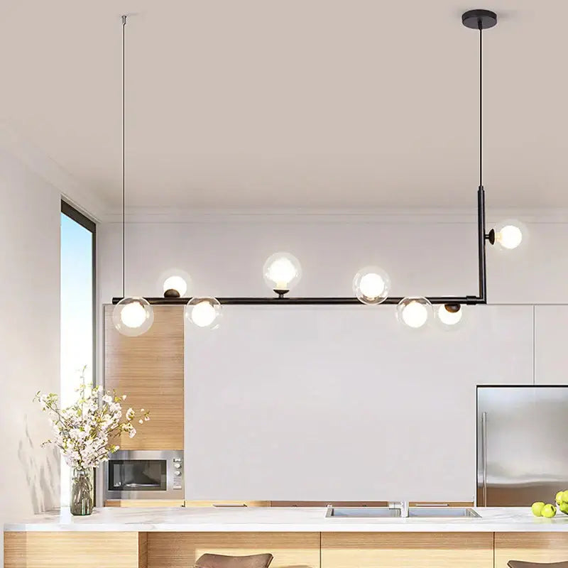 Modern black metal pendant light with double glass lampshade chandelier featuring clear globe bulbs for dining room
