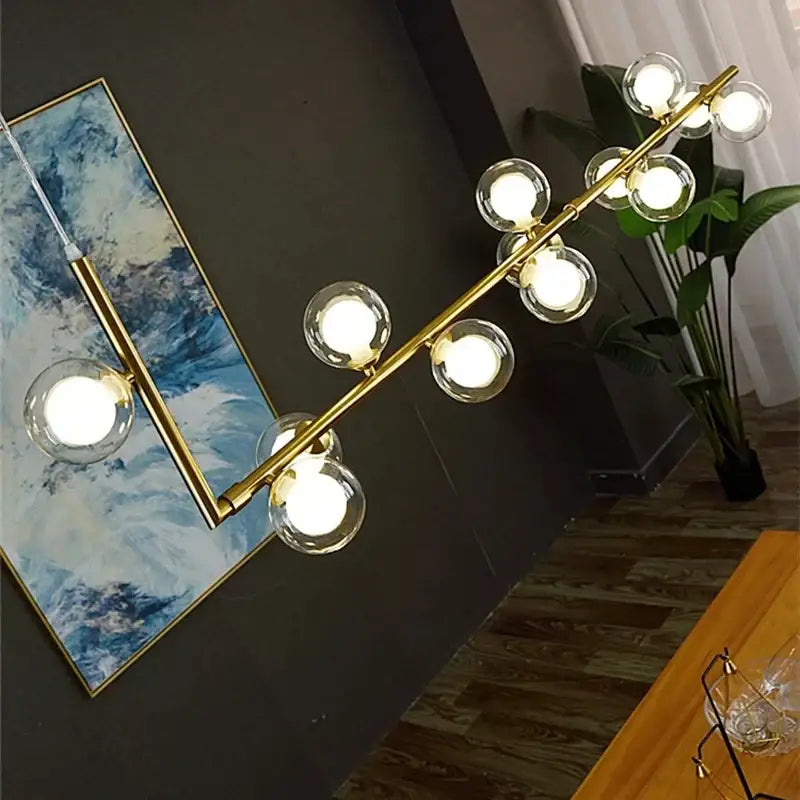 Modern black dual glass lamp ceiling chandelier with gold-toned frame and clear glass globe bulbs for dining room decorbites dual glass