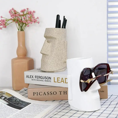 Beige textured stone moai head pen holder resin desktop organizer from decorbites for modern bedroom use