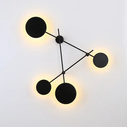 Modern black geometric iron wall lamp with glowing circular light fixtures for stylish living room decorbites geometric iron wall