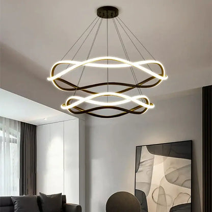 Modern black geometric led ring chandelier featuring double-tiered intertwined gold and white light rings suspended by cables
