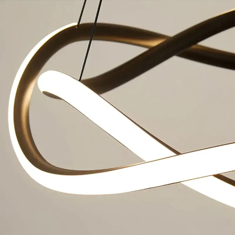 Modern black geometric led ring chandelier featuring an infinity-shaped gold-toned pendant light with white led strips