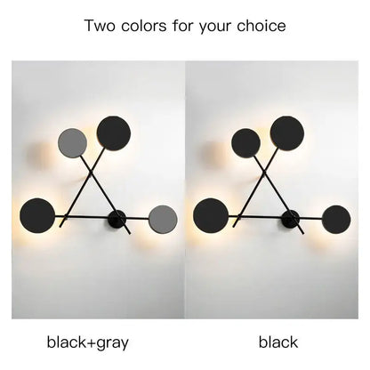 Modern black geometric led wall lamp featuring interconnected metal rods and circular discs for living room use
