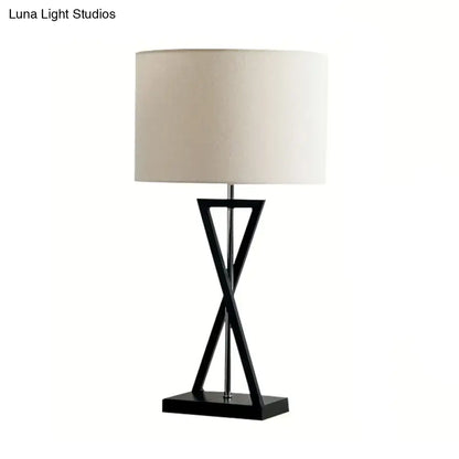 Black geometric drum nightstand lamp with cream fabric drum shade 1-light bedside table inch fixture by DecorBites