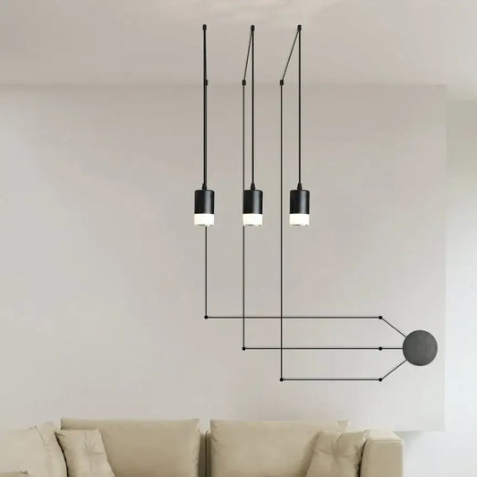 Modern black geometric pendant light fixture with three cylindrical led bulbs and wireframe design for dining room use