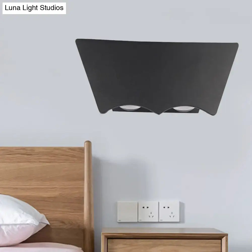 Modern black geometric wall sconce with black matte finish and two circular recessed bulbs providing warm white light 220v-240v 110v-120v