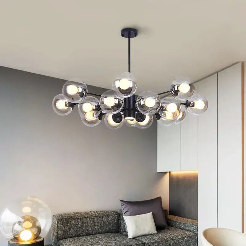 Modern black metal chandelier with multiple clear glass globe bulbs for dining room decorbites glass ball led lighting