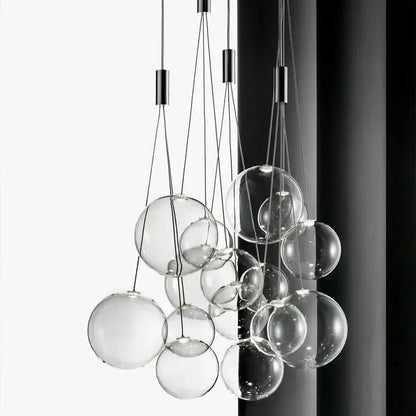 Modern black glass ball led pendant lamps featuring a clear glass sphere with sleek black metal hardware for kitchen decorbites pendant lamps