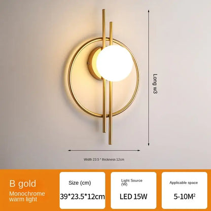 Gold-toned minimalist wall lamp with circular base and spherical frosted glass ball led for living room decorbites glass ball