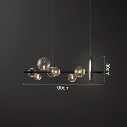 Modern black metal pendant lamps with clear glass ball bulbs and minimalist design for dining room decorbites glass ball