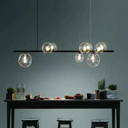 Modern black metal glass ball pendant light chandelier with clear glass globe bulbs for dining room decorbites pendant light