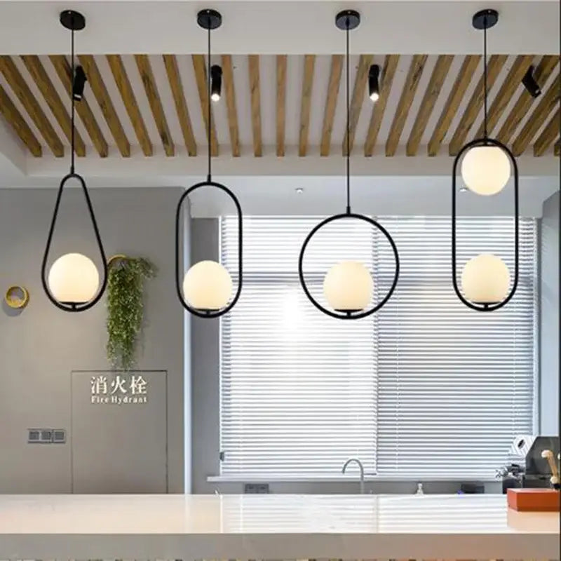 Set of four modern black metal pendant lights with frosted glass ball shades decorbites glass ball pendant for dining room