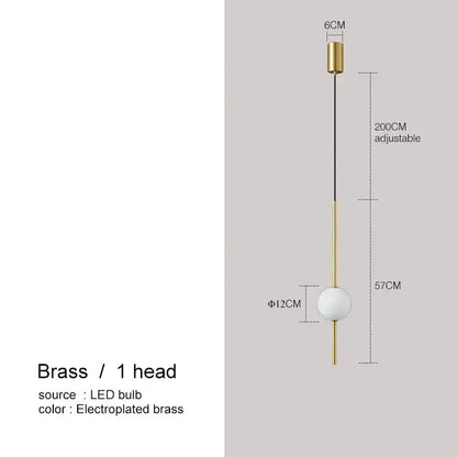 A sleek brass pendant light with a spherical white glass bulb and adjustable cable for modern decorbites glass ball pendant lights