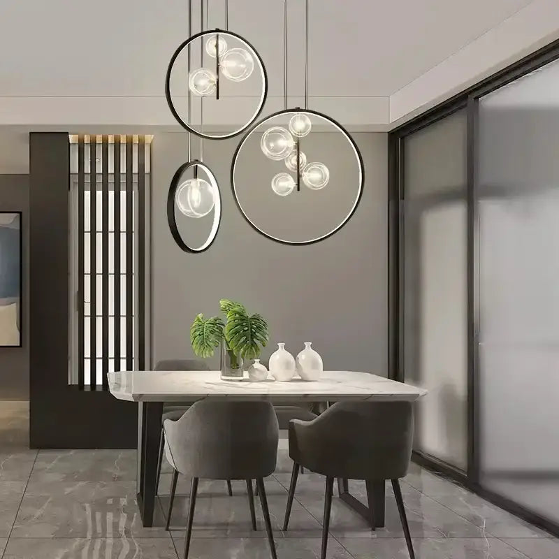 Modern black glass bubble chandelier featuring circular pendant lights with black metal frames for dining room decorbites glass bubble lighting