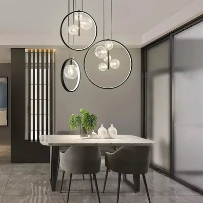 Modern black glass bubble chandelier featuring circular pendant lights with black metal frames for dining room decorbites glass bubble lighting