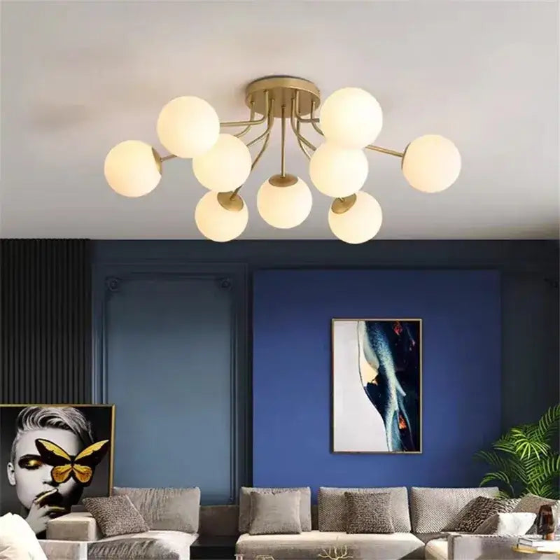 Modern gold-toned ceiling light with multiple frosted glass globe bulbs for decorbites glass bubble led living room decor