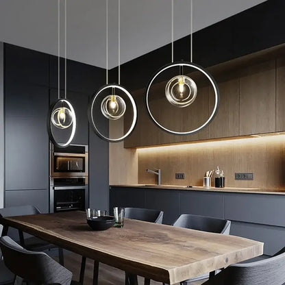Modern black glass bubble led chandelier featuring minimalist black and clear glass rings with warm bulbs for dining room decorbites glass bubble