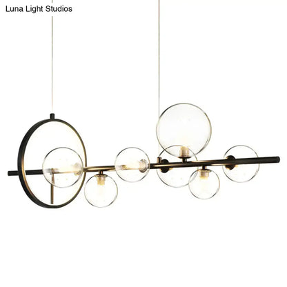 Modern black glass globe pendant light with clear glass spherical bulbs and circular accent for dining table lighting