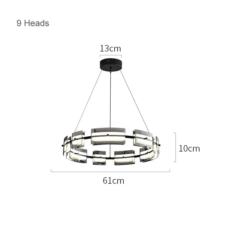 Modern black metal glass restaurant chandelier with nine illuminated rectangular light heads for dining room warm light