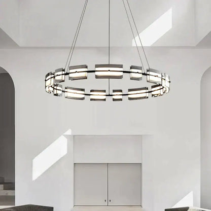 Modern black glass restaurant chandelier with sleek metal frame and frosted glass panels for warm dining room light