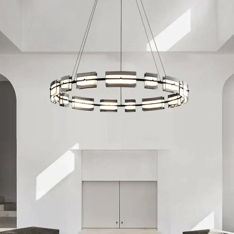 Modern black glass restaurant chandelier with sleek metal frame and frosted glass panels for warm dining room light