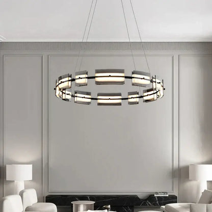 Modern black glass restaurant chandelier with sleek metal frame and frosted panels emitting warm light for dining room