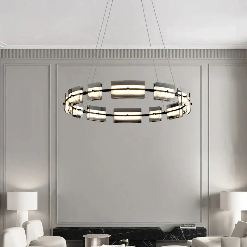 Modern black glass restaurant chandelier with sleek metal frame and frosted panels emitting warm light for dining room