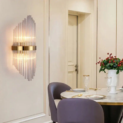 Modern black glass rod crystal wall lamp featuring vertical glass rods and a gold-toned metallic frame for bedroom use
