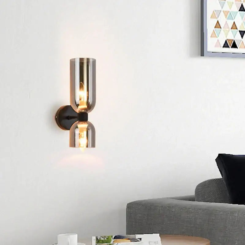 Modern black metal wall lamp with two cylindrical smoked glass shades for bedroom glass shade wall lighting