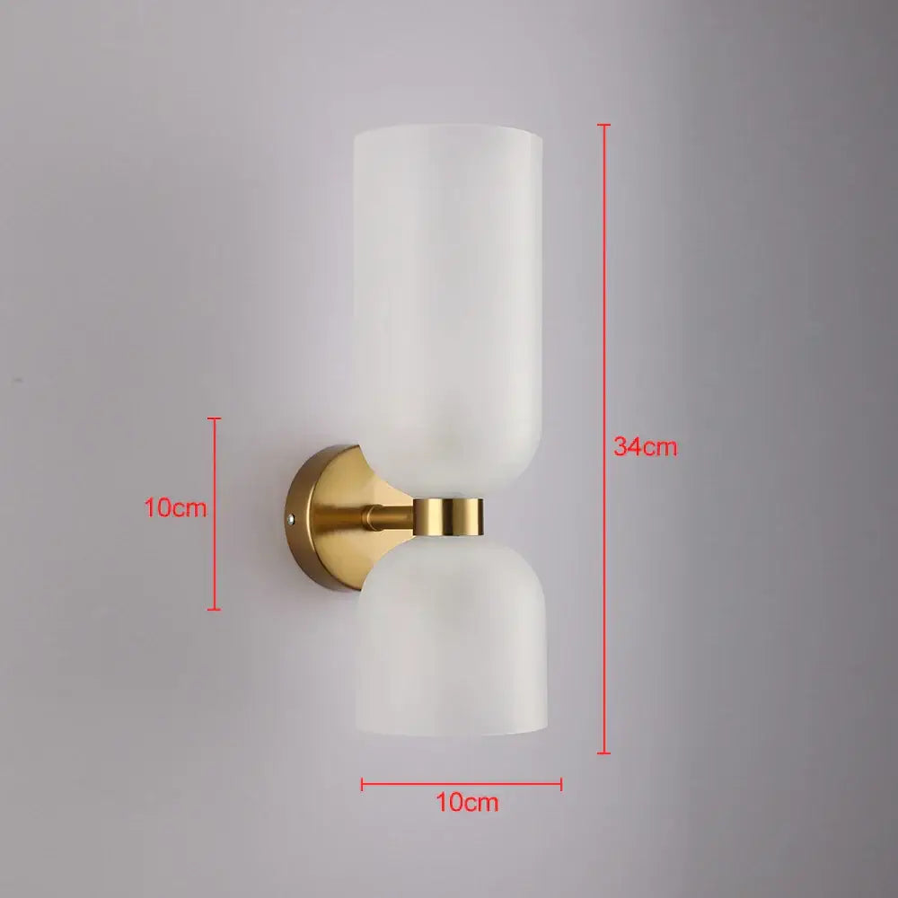 Modern wall lamp with two frosted white glass shades and brushed gold metal base for bedroom glass shade wall lighting