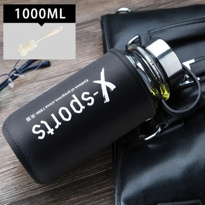 Modern black glass tea bottle with 1000ml insulated capacity and metallic lid featuring white x-sports branding by Decorbites glass tea