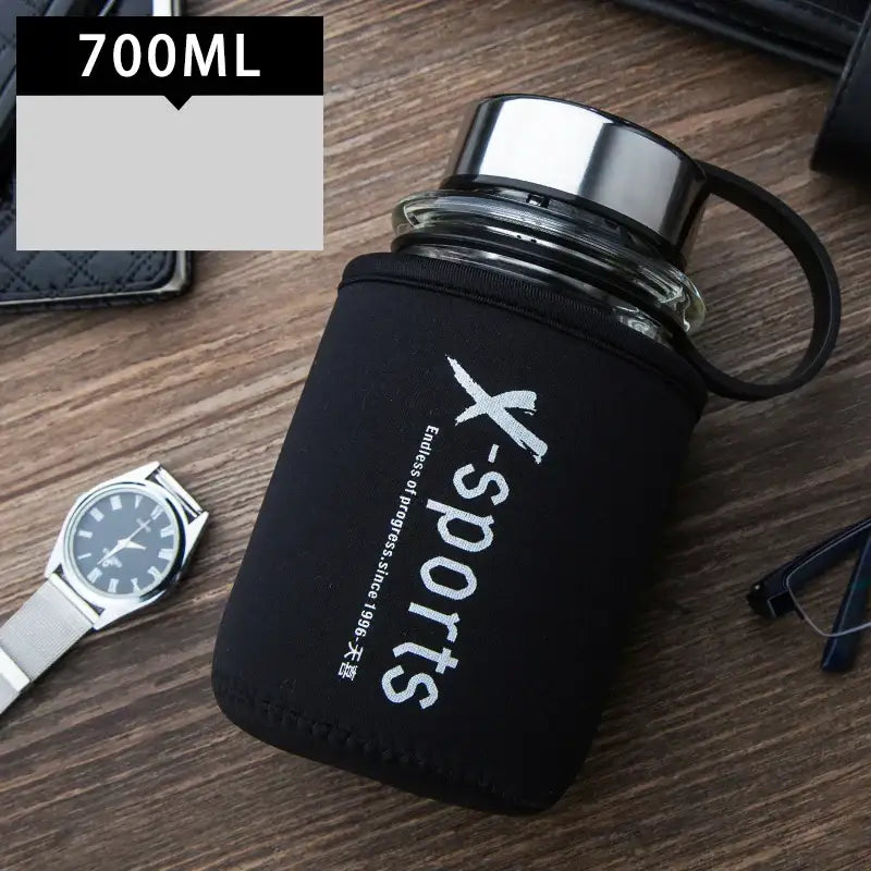 Modern black glass tea bottle travel flask with black neoprene sleeve featuring x-sports branding decorbites glass tea