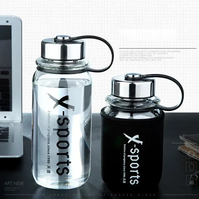 Modern black glass tea bottle with silver lid and black handle featuring x-sports branding for travel use decorbites glass tea