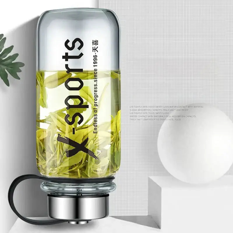Modern black glass tea bottle with silver metallic base black handle and x-sports branding by decorbites glass tea