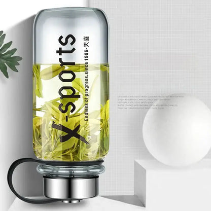 Modern black glass tea bottle with silver metallic base black handle and x-sports branding by decorbites glass tea
