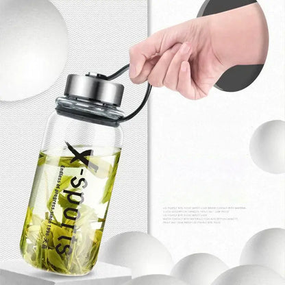 Modern black glass tea bottle with silver lid and black loop featuring x-sports branding by decorbites glass tea bottle