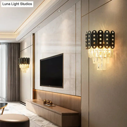 Modern black and gold 3-tiered wall-mounted light featuring clear faceted crystal droplets and embedded round accents