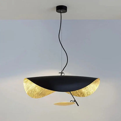 Modern black and gold leaf-shaped pendant lamp with sleek sculptural design ideal for dining room decorbites lederam manta