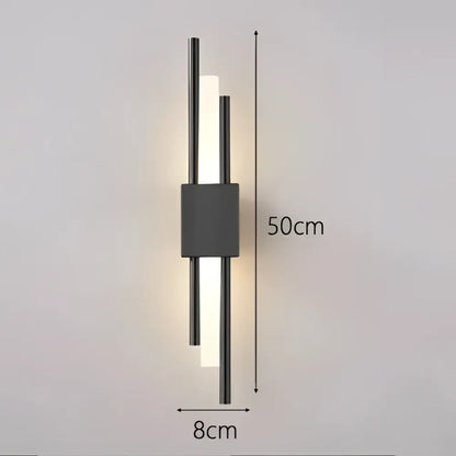 Modern black wall lamp with gold acrylic pipe features two vertical illuminated bars and a central rectangular accent