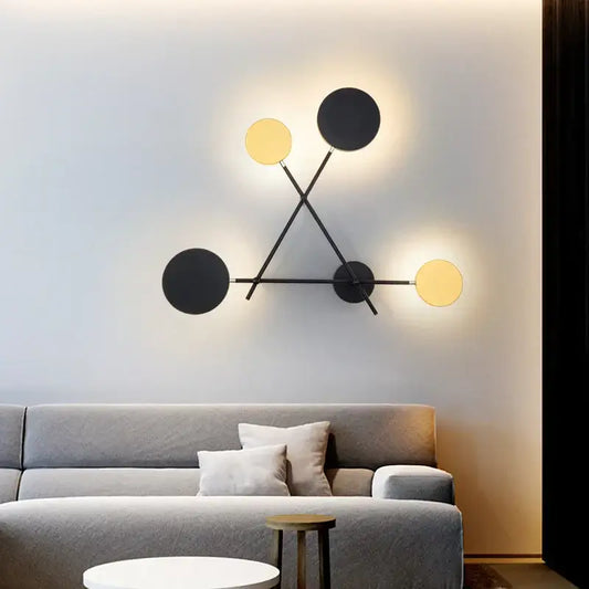 Modern black and gold decorbites adjustable rotating led wall sconce with four circular light fixtures for bedroom lighting
