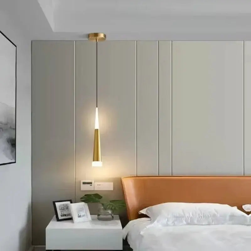 Modern black and gold aluminum cord pendant light with a gold-toned tapered design and warm ambient glow for bedroom