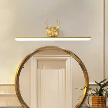 Gold-toned 220v-240v wall light with deer head antlers and acrylic shade for modern bathroom use