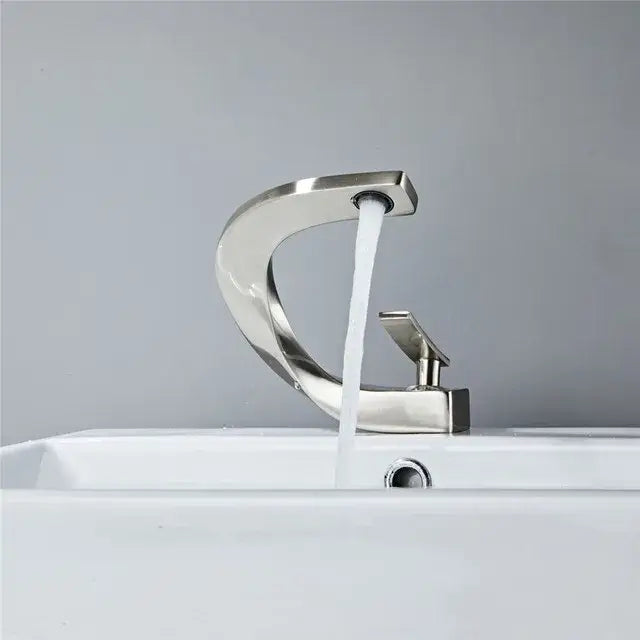 Modern decorbites black and gold basin faucet with brushed nickel finish and sleek curved single handle design