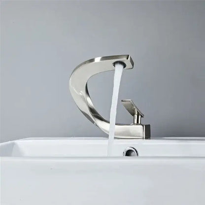 Modern decorbites black and gold basin faucet with brushed nickel finish and sleek curved single handle design