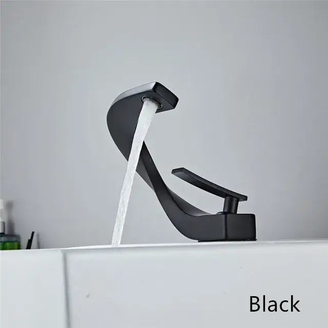 Modern black and gold basin faucet with matte finish sleek curved design and waterfall spout by decorbites black