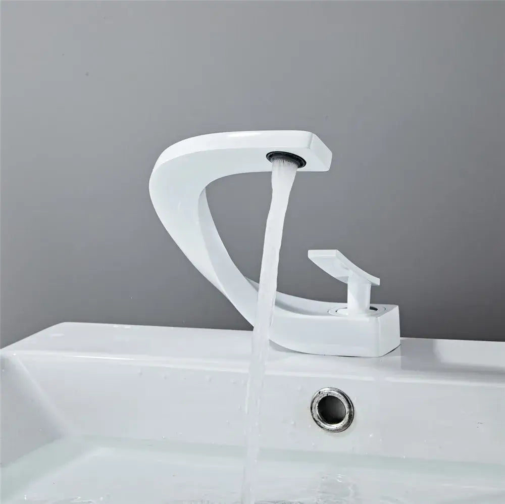 Modern white ceramic basin faucet with sleek curved design and single handle for decorbites black gold basin faucet